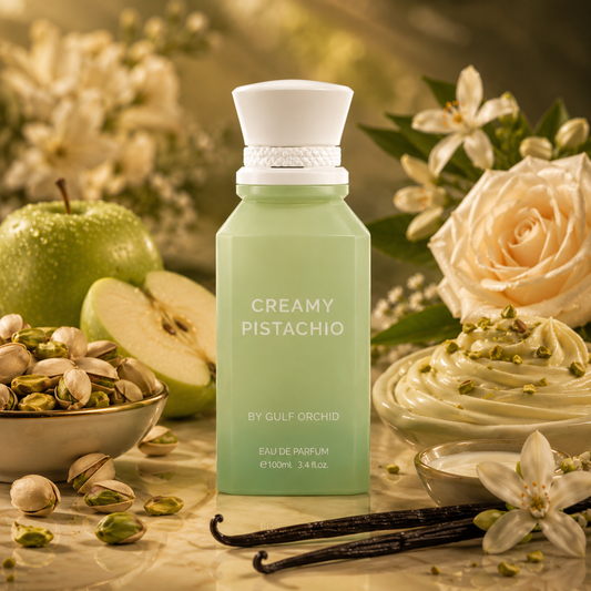 Perfume bottle labeled 'Creamy Pistachio' surrounded by pistachios, apples, and flowers. Deccant dealer nz 