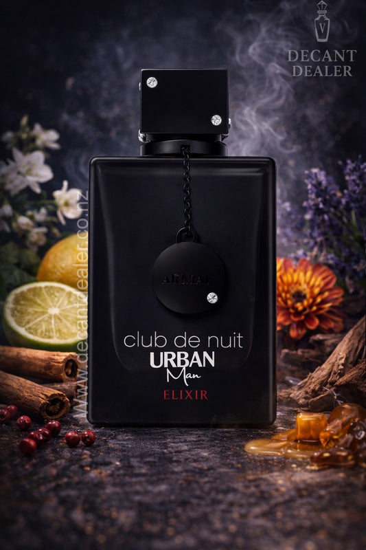 Black perfume bottle labeled 'Club de Nuit Urban Man Elixir' with decorative elements on a dark background.